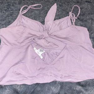 Cropped light purple tank top with tie in the back. Size xs